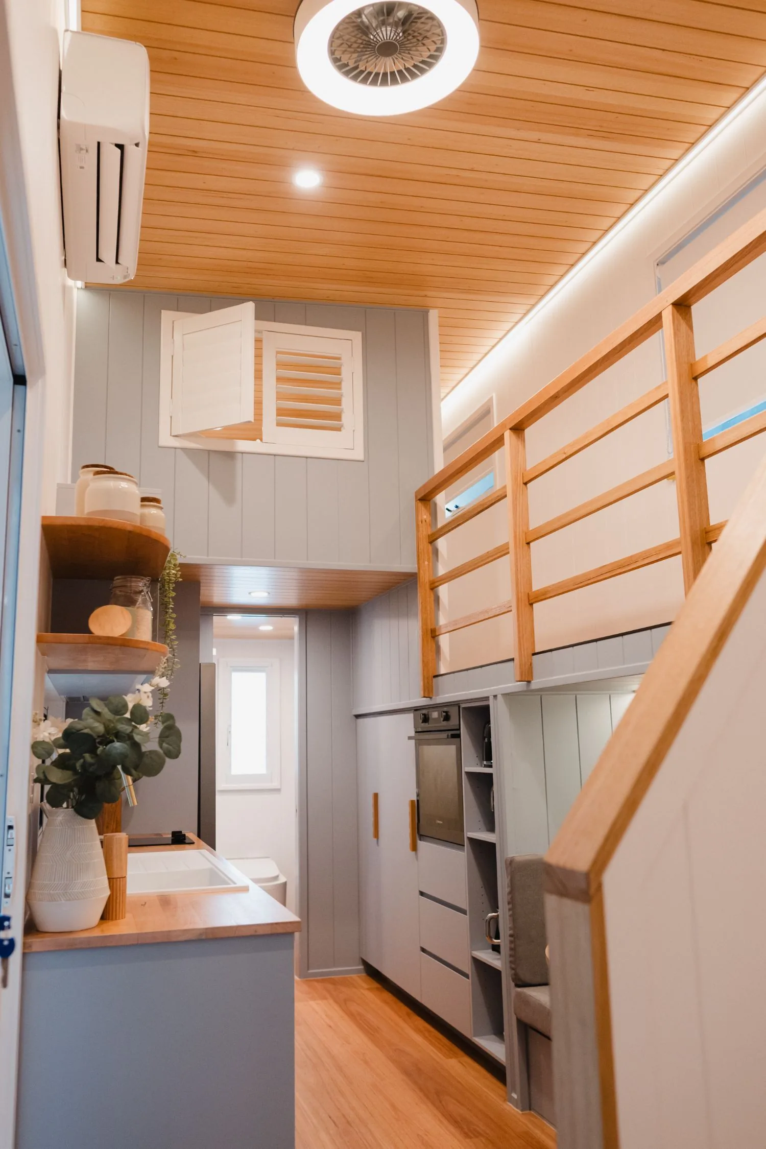 Serenity galley looking through to the bathroom, loft rail above